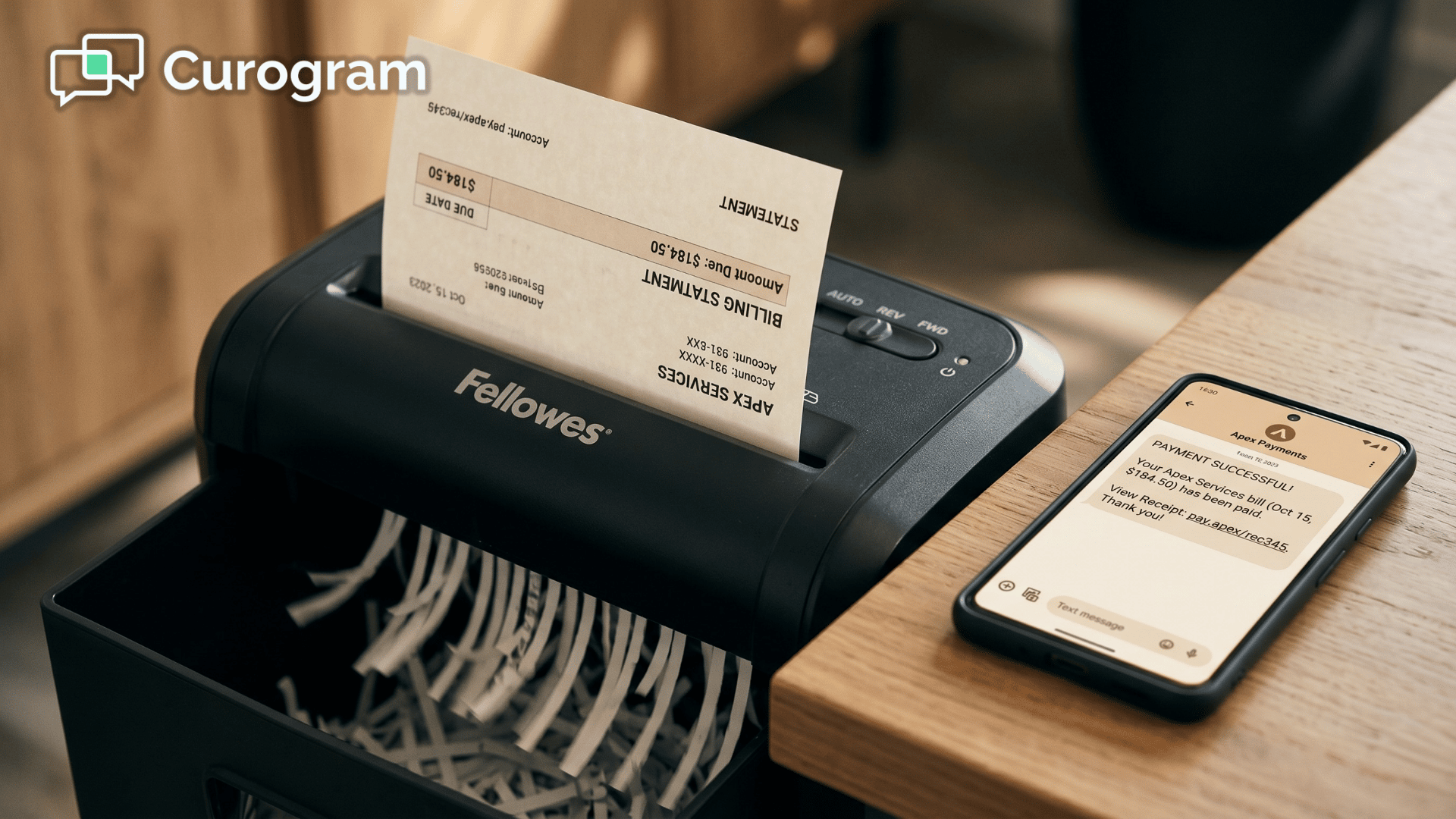 Paper medical statement shredded beside phone showing a text payment link 
