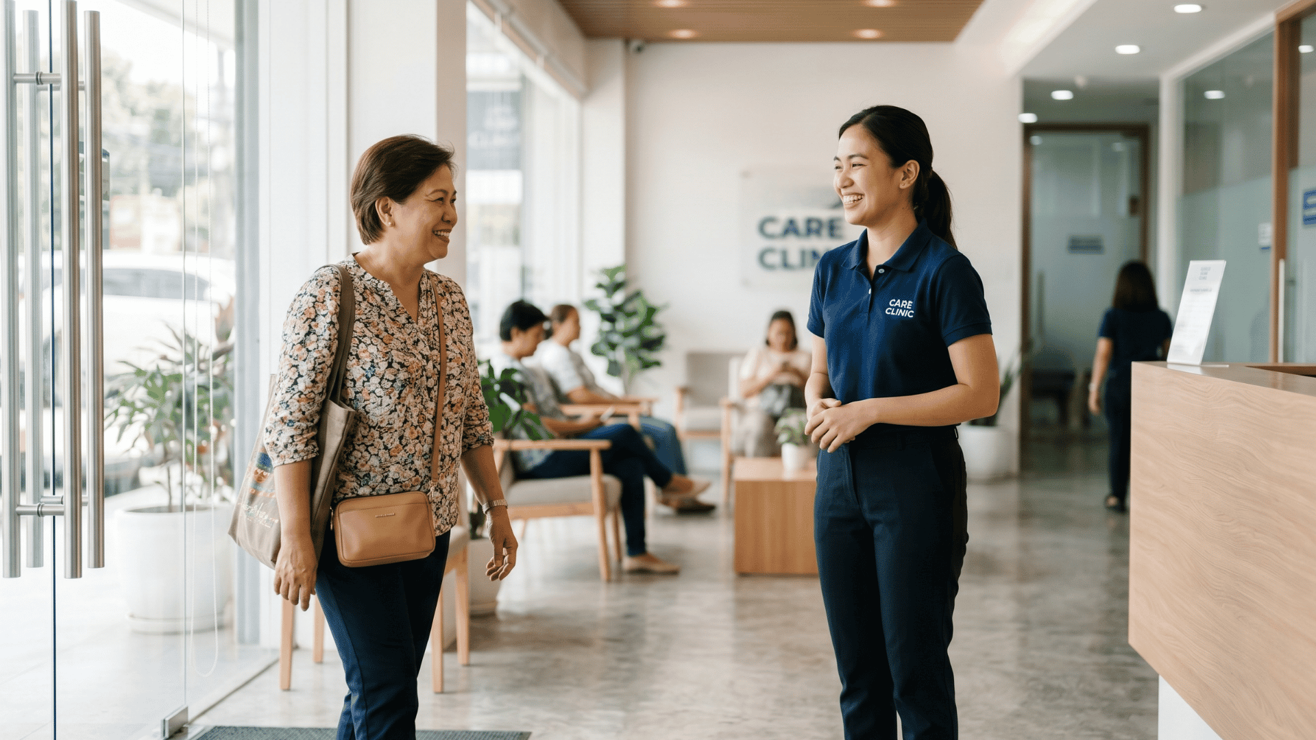 Patient warmly welcomed at a clinic reception after completing intake forms before the visit