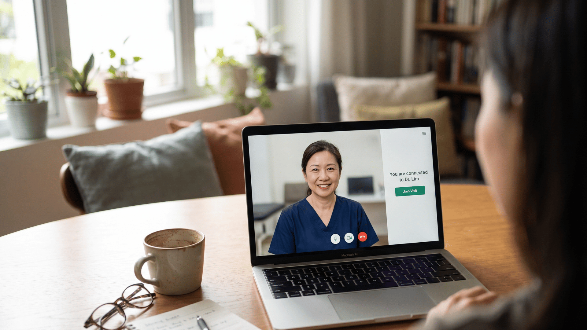 Single-link telemedicine video visit connecting on a laptop at home for an easy CharmHealth virtual appointment